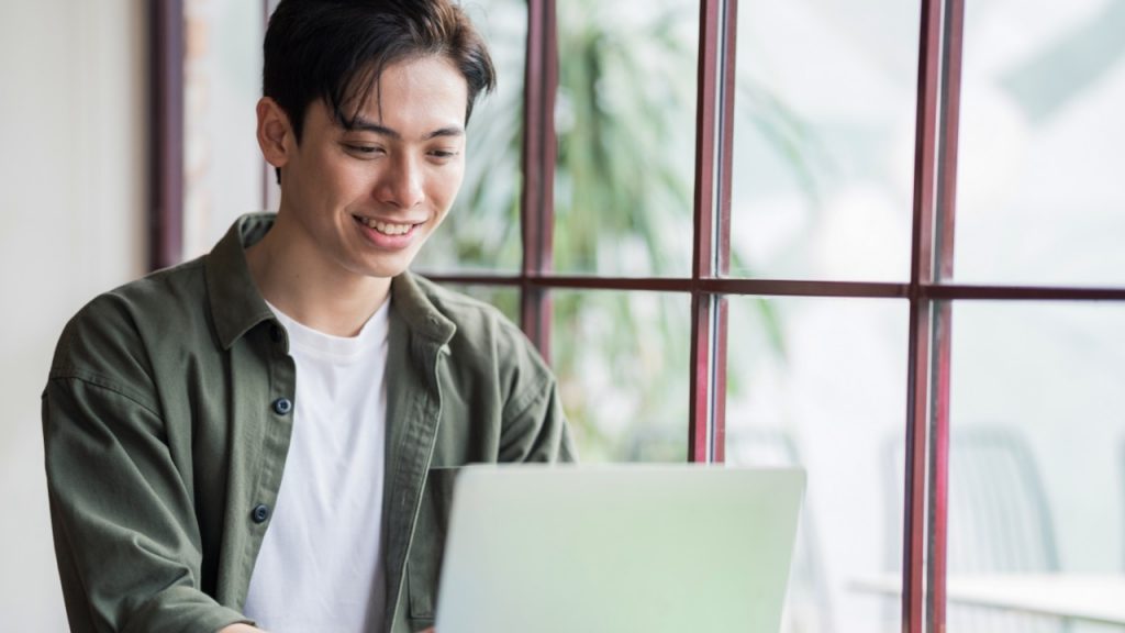 student applying at laptop