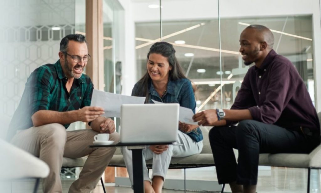 group of business students at a laptop
